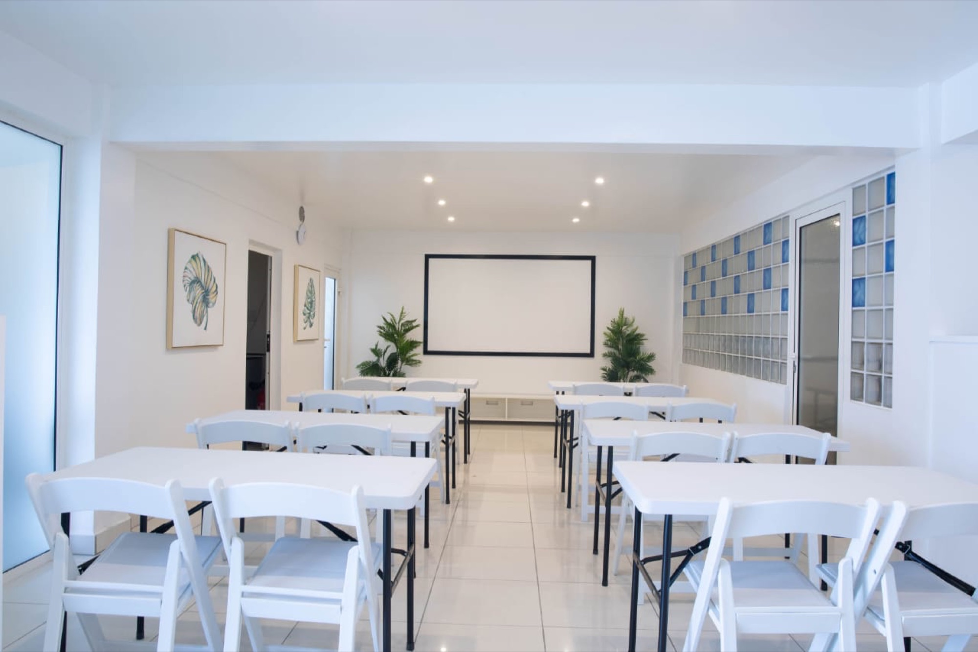 Aida Hall set in classroom layout under natural light
